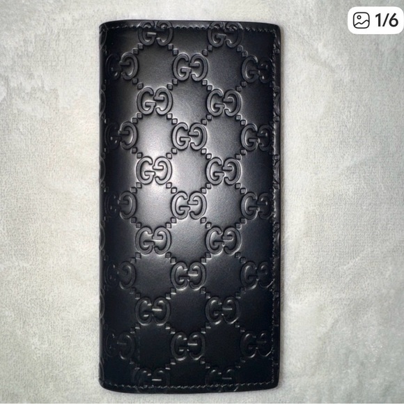 Gucci Other - Gucci Black GG Embossed Wallet